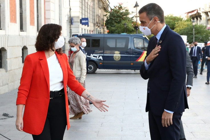 Diaz Ayuso, pictured with Sanchez, has showed herself to have an aggressively confrontational style