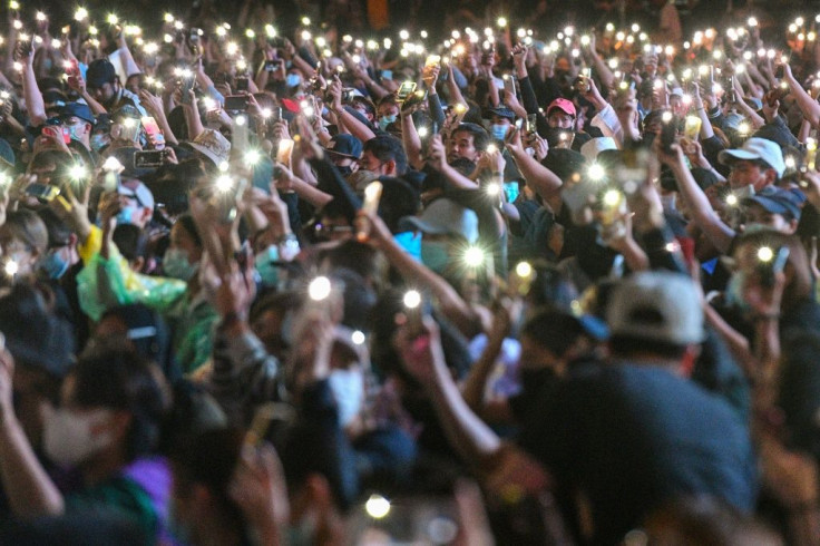 An estimated 20,000 protesters gathered near Victory Monument in Bangkok despite a ban on public gatherings