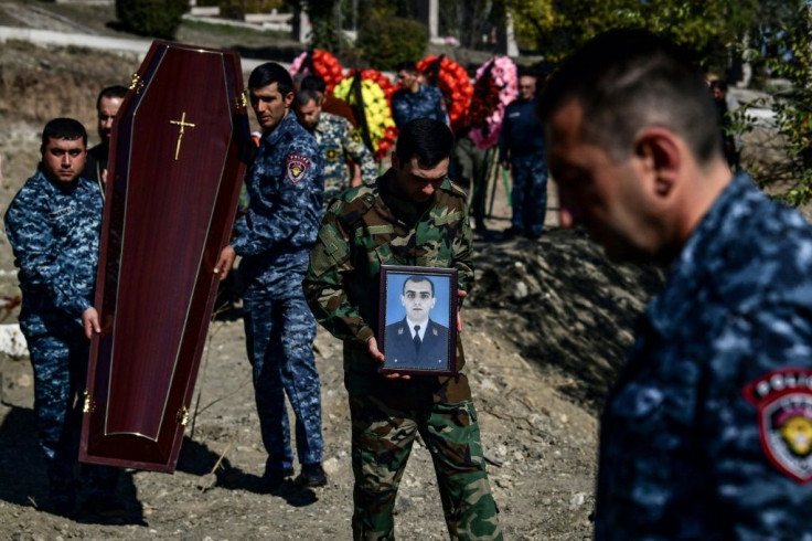 The newly dead were buried alongside the graves of soldiers killed in the first war over Karabakh