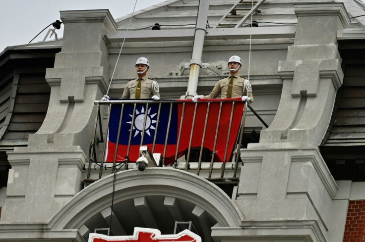 The Taiwanese flag is raised at the Presidential Office in Taipei to mark National Day. Just 15 countries recognise Taiwan, mostly in the Pacific and Latin America