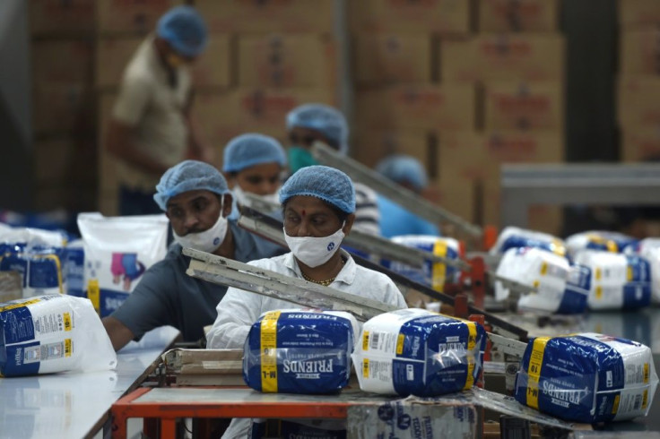 India is on course to top the world in coronavirus cases, but from Maharashtra's whirring factories to Kolkata's thronging markets, people are back at work -- and eager to forget the pandemic for the festival season