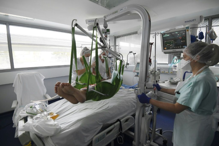 Medical staff tend to a patient in an intensive care unit for the novel coronavirus at the University Hospital of Strasbourg in France