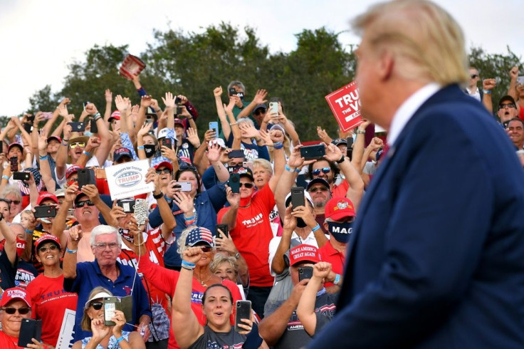 Supporters cheer US President Donald Trump at The Villages, a retirement community in Florida