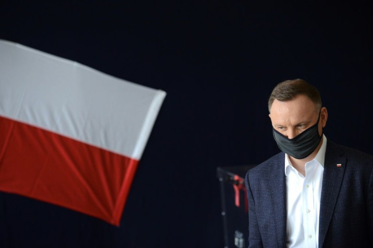 Polish President Andrzej Duda arrives at a polling station in Krakow on June 28 to vote during Poland's Presidental election.