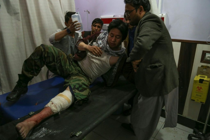 A wounded man receives treatment in a hospital after a suicide bombing in Kabul