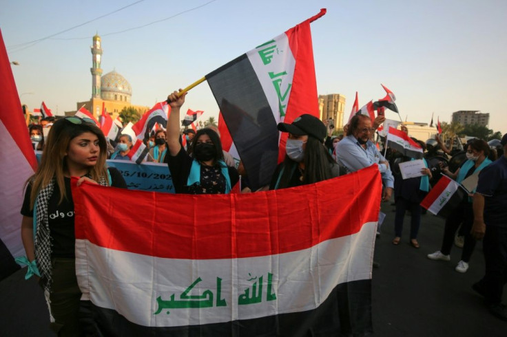 Iraqis demonstrate in Baghdad's Al-Firdous Square on October 1 during a commemoration of the mass anti-government protest movement that started a year ago