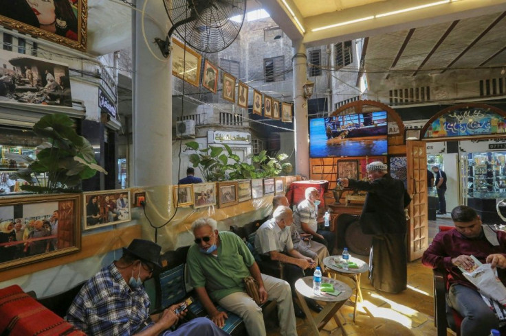 Iraqis sit at a traditional cultural coffee shop, one of several gathering spots for the country's intellectuals, in the capital Baghdad's al-Rashid street