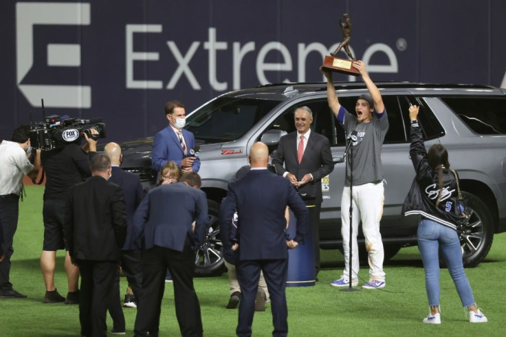 Los Angeles shortstop Corey Seager hoists the World Series MVP trophy after the Dodgers vanquished the Tampa Bay Rays in six games to win the Major League Baseball title