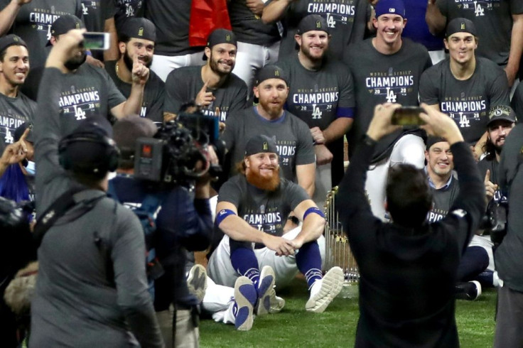 LA Dodgers star Justin Turner sits with team-mates after the World Series victory, despite being told to isolate after a positive Covid-19 case