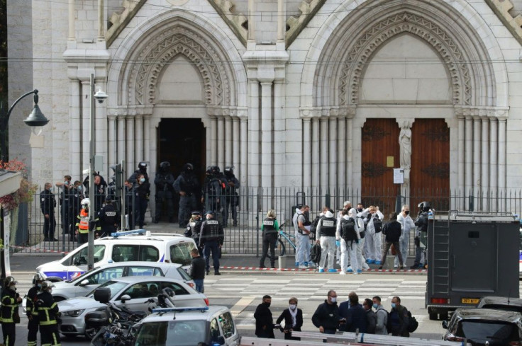 France's national anti-terror prosecutors have opened a murder inquiry after a man killed three people at a basilica in central Nice and wounded several others