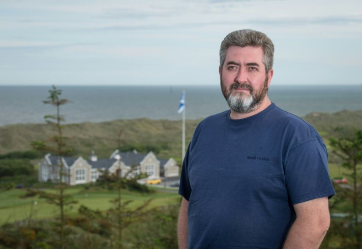 David Milne, seen on a hillside above the  clubhouse of Donald Trump's International Golf Links course on Scotland's east coast, is aghast that the local council has given the go-ahead for a second course