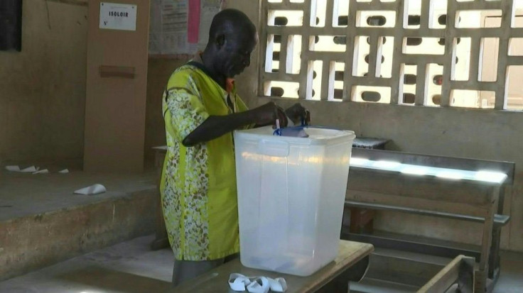 IMAGES Polling stations open in CÃ´te d'Ivoire for presidential elections after a campaign marked by inter-community violence. Two of the four candidates are boycotting the vote OVER President Alassane Ouattara's contested attempt to secure a third term. 