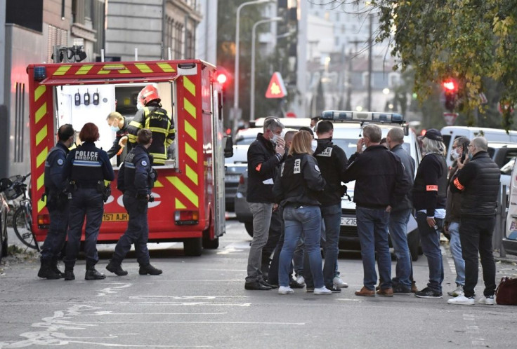Security and emergency personnel at the scene of the attack in Lyon on Saturday