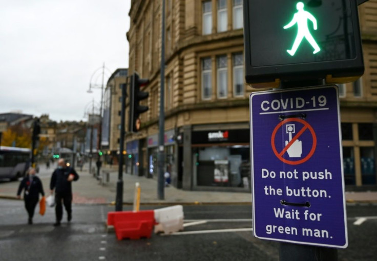 Pedestrians in the northern English town of Bradford are asked to not even press the button at a pedestrain crossing, for fear of spreading the virus