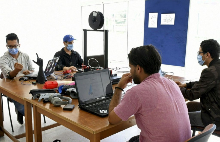 Tunisian engineers test a prototype of an artificial hand, which they hope will be produced at a lower price than existing prostheses