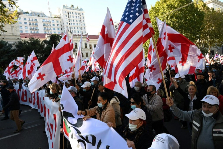 Georgians protest in the capital Tbilisi against the ruling party led by billionaire ex-prime minister Bidzina Ivanishvili which won the October 31 polls with a two-percent margin. It denies accusations of electoral fraud.