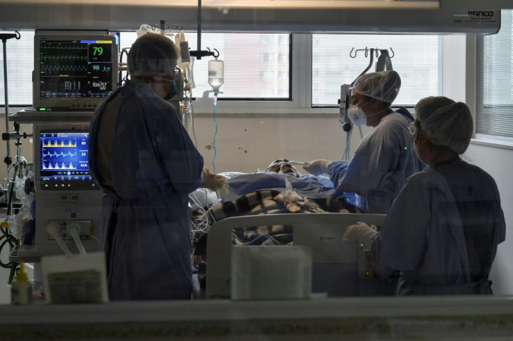Health workers take care of a COVID-19-infected patient at the Intensive Care Unit, in the Emilio Ribas hospital in Sao Paulo, Brazil