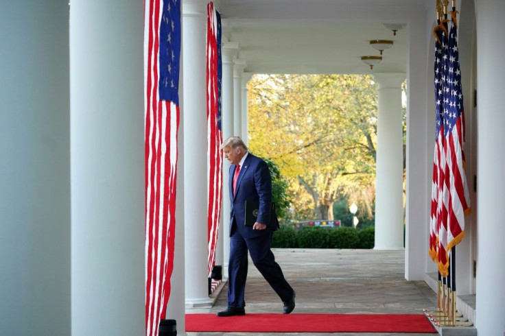 US President Donald Trump arrives to deliver an update on Covid-19 vaccines in the Rose Garden of the White House in Washington, DC on November 13