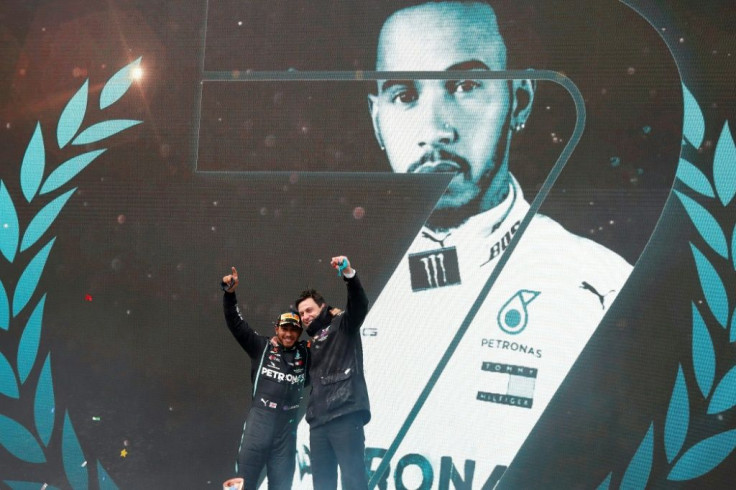 Hamilton celebrates with Mercedes boss Toto Wolff