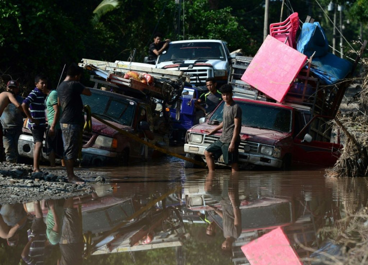 Banana workers stranded at a flooded road while trying to evacuate from El Progreso in Yoro, Honduras, ahead of the arrival of Iota