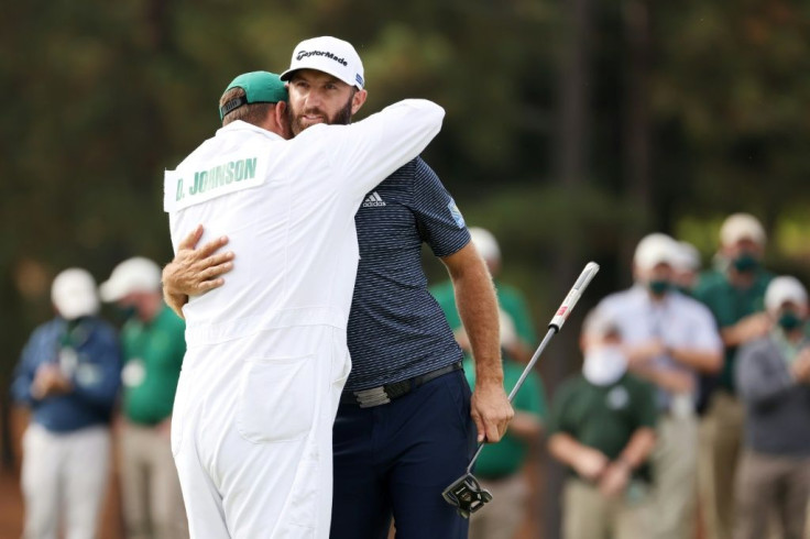 Masters winner Dustin Johnson, right, celebrates the victory by hugging his brother, and caddie, Austin Johnson