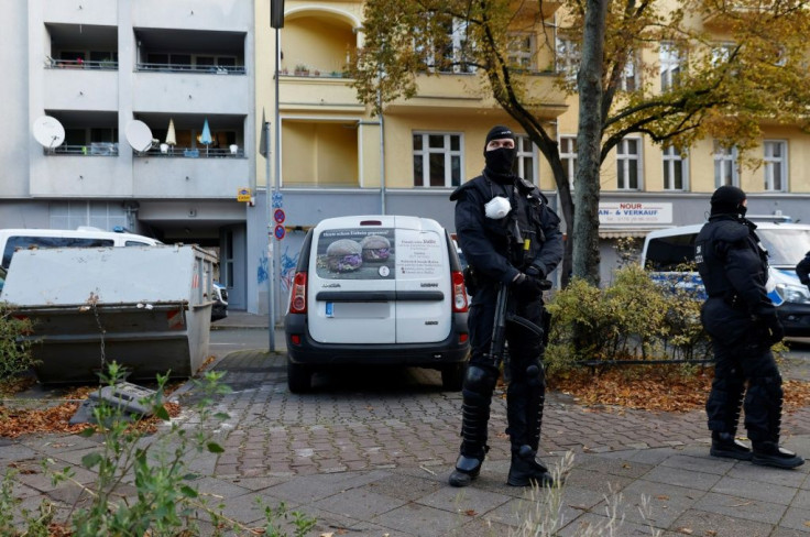 Investigators were searching 18 properties in Berlin