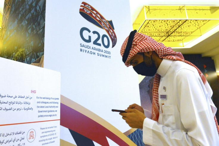 A Saudi man checks his phone amid preparations for the G20 summit in Riyadh