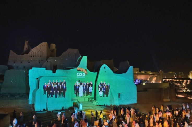 A group photo of G20 leaders is projected onto the walls of a historical site on the outskirts of the Saudi capital Riyadh, ahead of the virtual summit