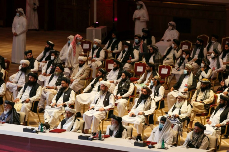Peace talks between the Afghan government and the Taliban opened in September in Doha; here Taliban delegates listen during the opening session