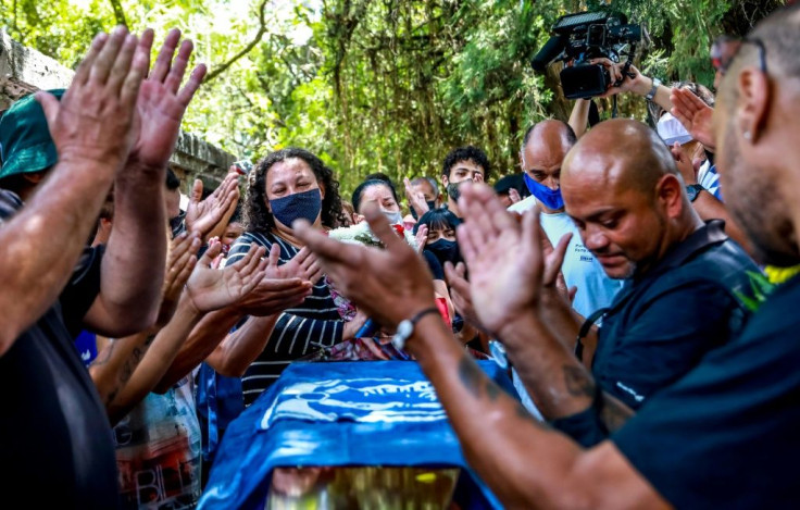 Relatives and friends of Joao Alberto Silveira Freitas, who died after being beaten by white security agents in a Carrefour supermarket, attend his funeral in Porto Alegre, Brazil, on November 21, 2020