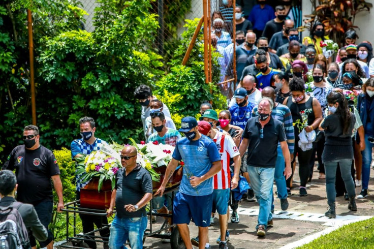 Relatives and friends of Joao Alberto Silveira Freitas, who died after being beaten by white security agents in a supermarket, walk with his coffin in Porto Alegre, Brazil, on November 21, 2020