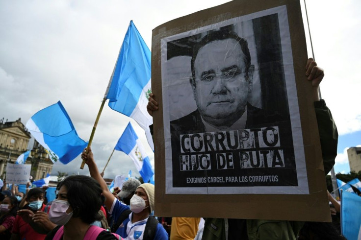 Demonstrators take part in a protest demanding the resignation of Guatemalan President Alejandro Giammattei, at Constitucion Square, in Guatemala City on November 21, 2020