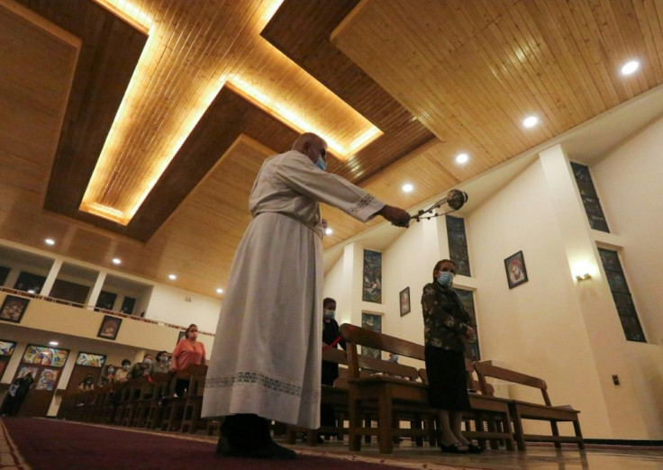 After 35 years serving at St. Joseph's and watching the parish shrink year by year, Nael (centre) says he has little hope