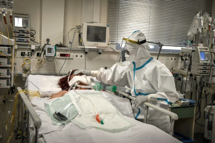 A nurse attends to a patient suffering from Covid-19 in an Athens suburb on November 20, 2020