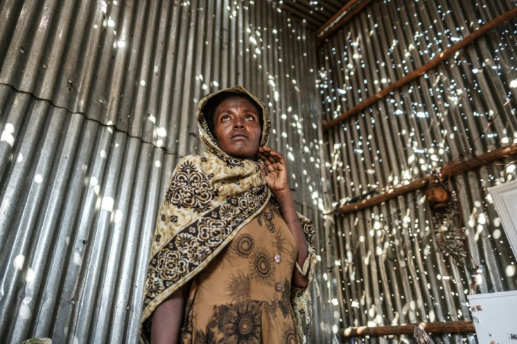 A resident of the Tigray town of Humera stands in a room riddled with bulletholes after the assault by Ethiopian forces