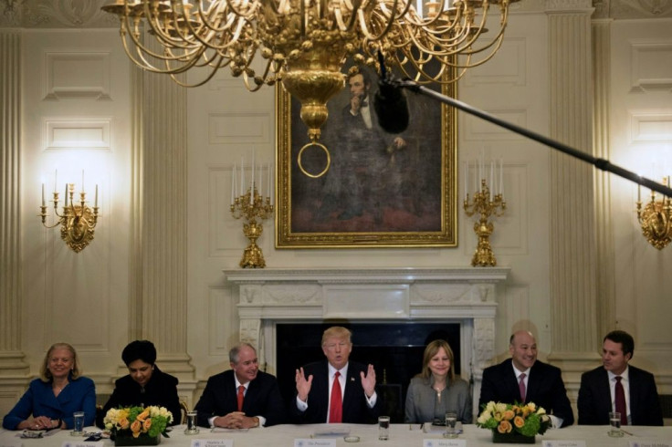 Blackstone Group CEO Steve Schwarzman (third from left) and General Motors CEO Mary Barra (third from right) -- seen here flanking President Donald Trump at a 2017 White House meeting -- are looking ahead to working with Joe Biden's administration