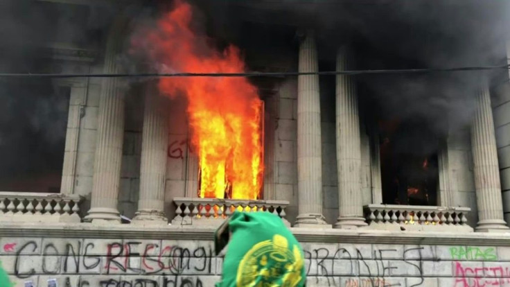 IMAGES Hundreds of Guatemalans burn down the Congress building to protest the approval of the 2021 budget, the highest in the country's history, and demand the resignation of President Alejandro Giammattei for endorsing it.