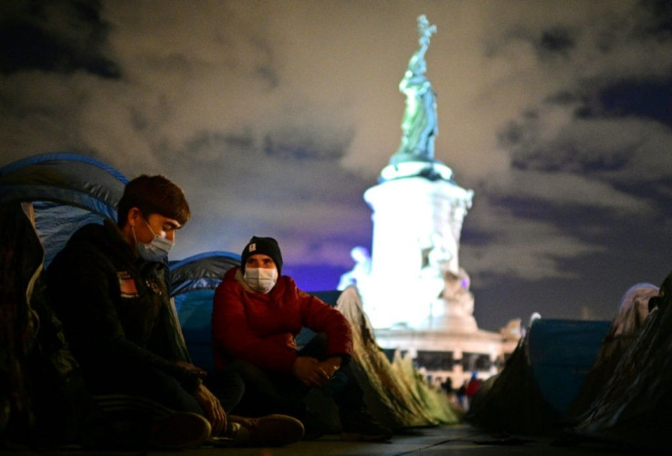 Volunteers had helped set up about 500 blue tents at Republic Square that were quickly filled by migrants, the majority from Afghanistan