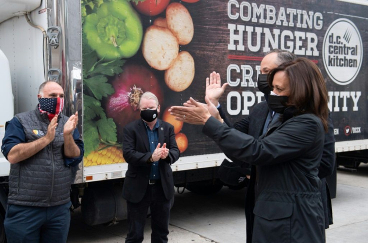 US Vice President-elect Kamala Harris and her husband Doug Emhoff visit a food bank in Washington, DC on November 25, 2020, ahead of the Thanksgiving holiday