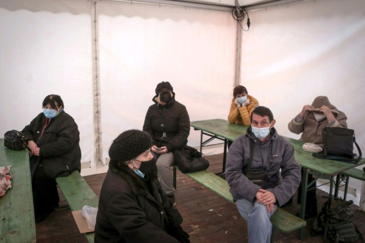 People wait for a medical examination outside the Clinic for Infectious and Tropical Diseases in Belgrade
