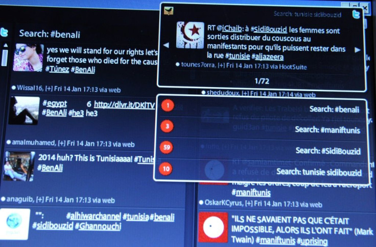 A computer screen shows tweets posted by users on January 14, 2011 about the situation in Tunisia