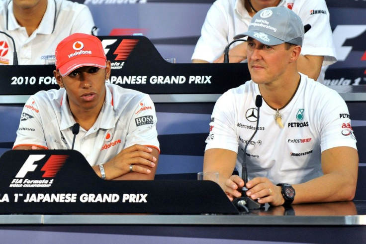 Michael Schumacher pictured in 2010 with Lewis Hamilton, the driver who this year equalled his record of seven world titles