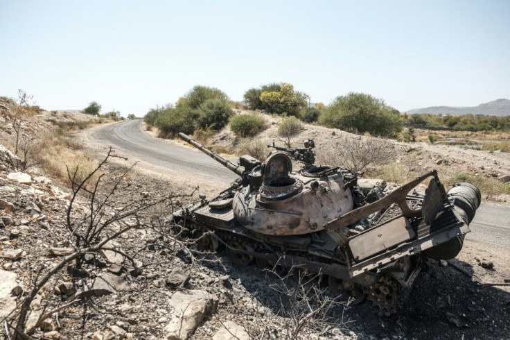 A damaged tank stands abandoned on a road near Humera, northwest Ethiopia