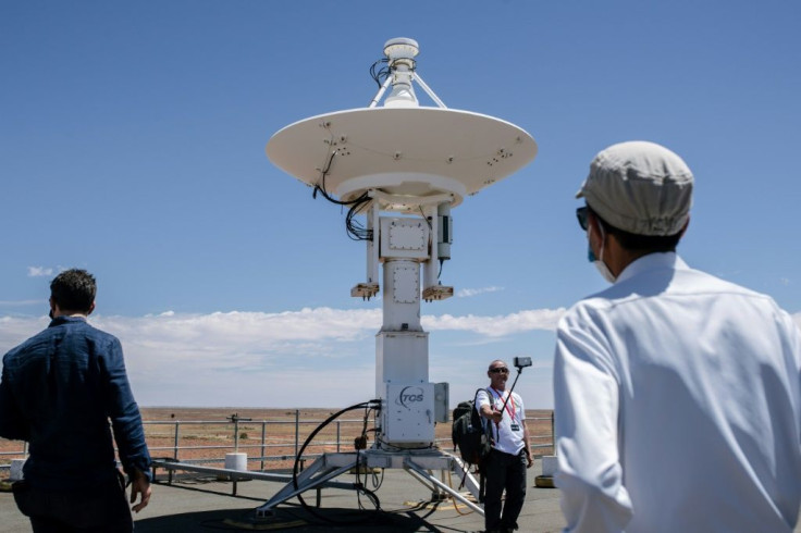 Japan Aerospace Exploration Agency (JAXA) officials and reporters tour the roof of the Royal Australian Air Force's Woomera Range Complex in South Australia ahead of capsule's arrival