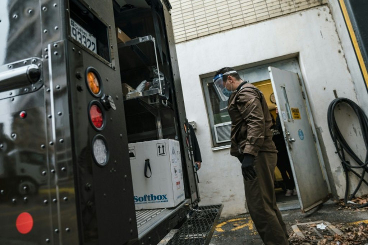 A UPS employee looks at a box with some of Canada's first Covid-19 vaccines in Montreal, Quebec on December 14, 2020