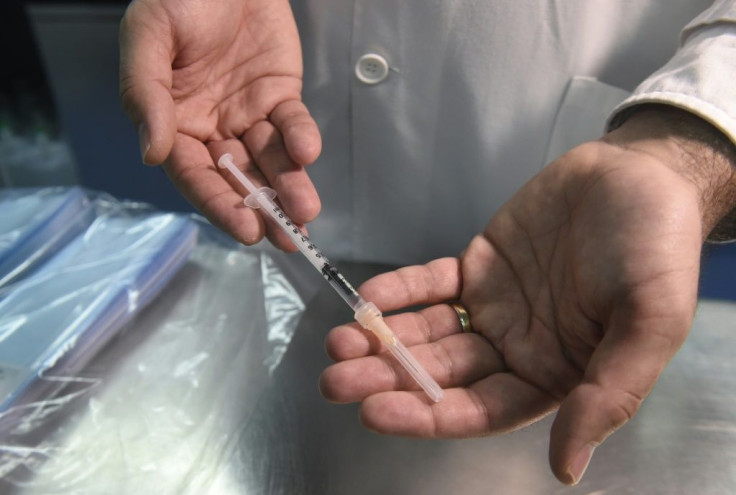 A doctor shows a syringe at the Sao Joao Hospital in Porto, where the first batch of Covid-19 vaccine arrived on December 26, 2020, one day before the coronavirus vaccination program starts in Portugal