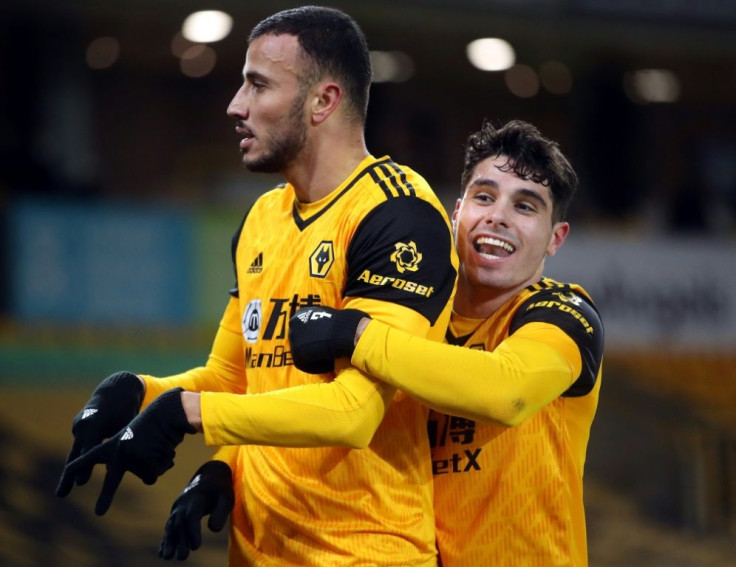 Wolves bite back: Romain Saiss (left)scored Wolves' equaliser in a 1-1 draw with Tottenham