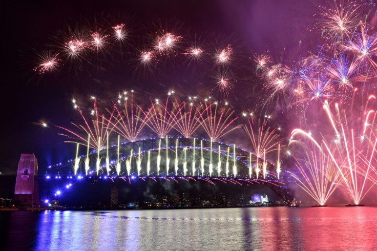 In Sydney, fireworks lit up the harbour with a dazzling display but few spectators watched in person