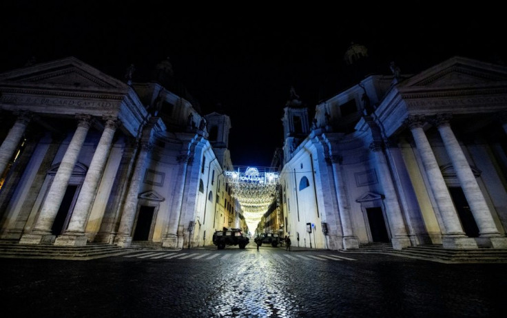 Military vehicles patrol on Piazza del Popolo in central Rome on December 31