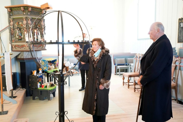 King Harald and Queen Sonja visited the site and lit candles in a local church
